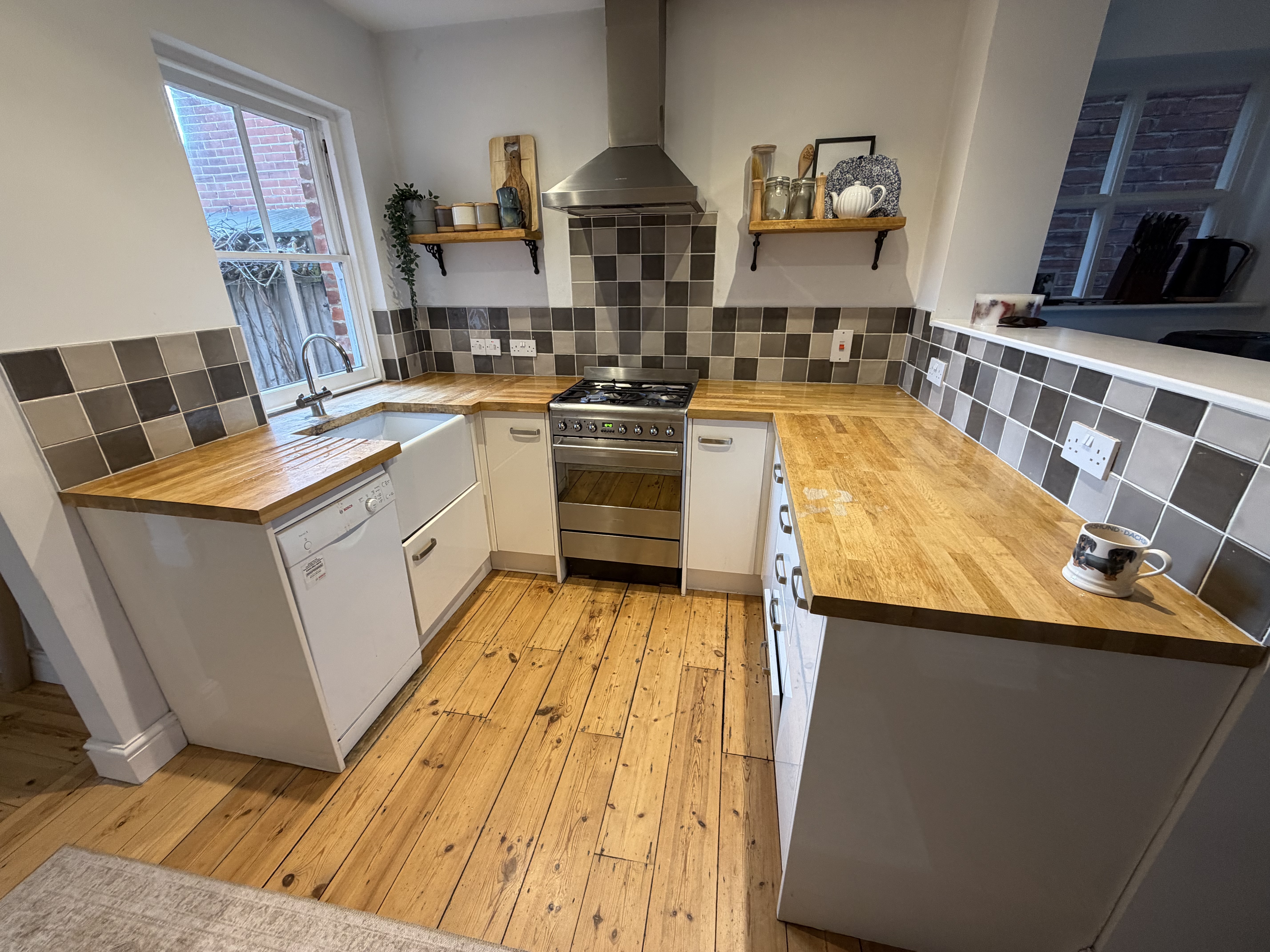 Real customer kitchen with high gloss mussel venice slab kitchen doors in a clean modern design